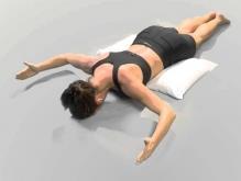 Prone W Begin by lying face down on a comfortable surface with a pillow under your stomach and a towel under your forehead.
