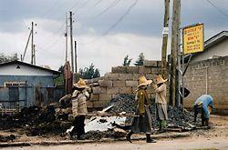 Some Specifics: The Ethiopian Experience Members of an all-female road construction crew move piles of gravel in Addis Ababa, Ethiopia. In January 1998, the World Bank approved a $309.