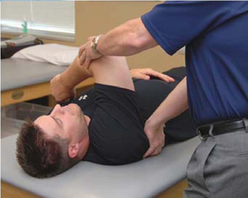 IR Stretch Horizontal Adduction with IR Figure 8. Horizontal adduction with internal rotation stretch. The patient flexes the arm to 90.