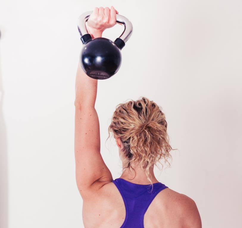 ONE-ARM PRESS Challenge your shoulders with one kettlebell. Steps 1 2 3 Clean the kettlebell. To do so, straddle the kettlebell on the floor with feet slightly wider than shoulder-width.