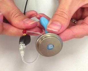 The hearing aid settings must be the same as in the Ear Response test. Place the probe tube into the customized opening in the side of the coupler.