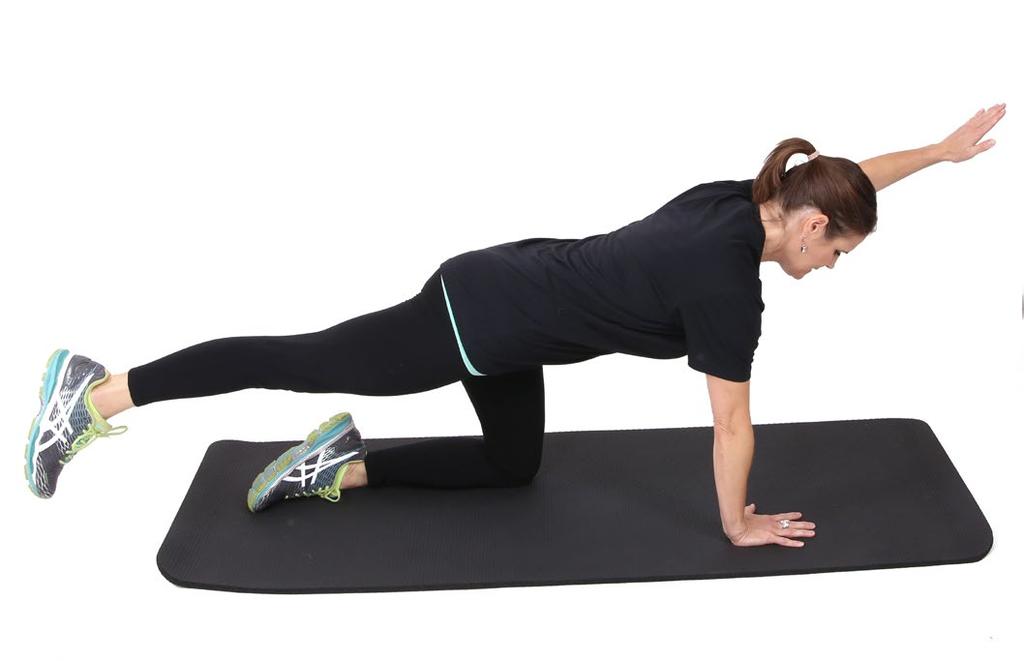 Inhale and extend your right arm out in front of your shoulder while extending your left leg straight back. Exhale and hold for 5 seconds. Release and return to starting position.