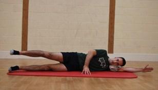 Side Leg Lifts Starting position: Side lying. Underneath arm outstretched in alignment with the trunk. Rest your head on your arm. Hips slightly bent with legs out long in alignment with the trunk.