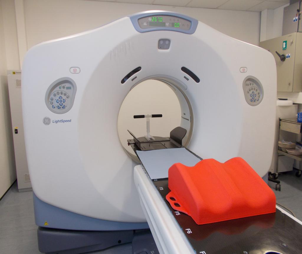 They will also use a red knee rest to allow you to be more comfortable for your treatment. Depending on the requirements of the oncologist, some patients may be scanned with their arms by their sides.
