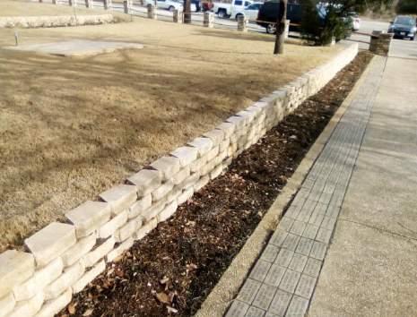 They were assigned to build a retaining wall in front of the administration building.