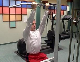 Pull the bar slowly down towards your chin; be careful to not arch your back.