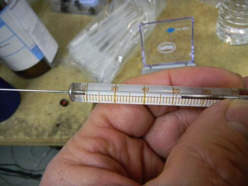 Using the 100ul syringe supplied with the SRI GC, measure 64ul of pure ethanol