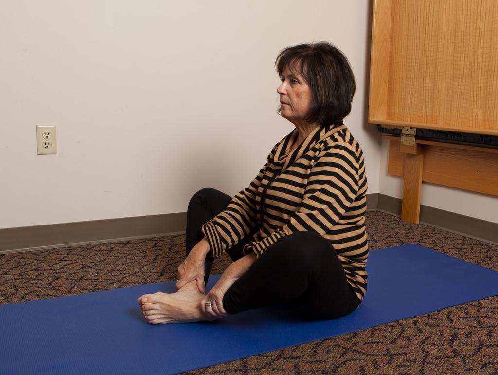 Cobbler Position GY Sit on mat on floor. Bring bottom of feet together touching each other; allow knees to drop open.