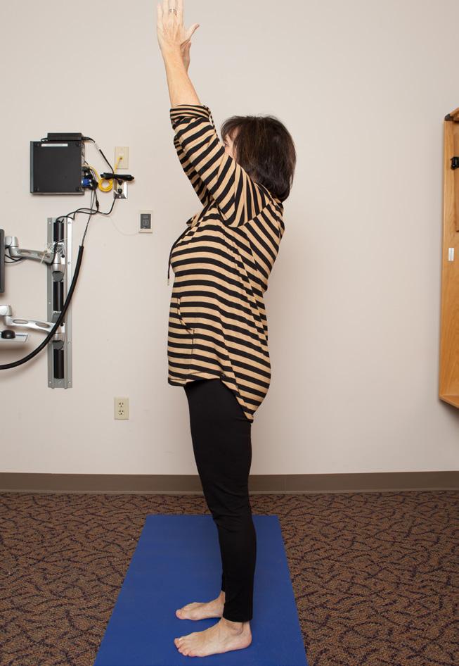 Stretch your whole spine upward and lift the top of your head to the sky. Extended Mountain Position GY Stand with the feet at hip-width apart.