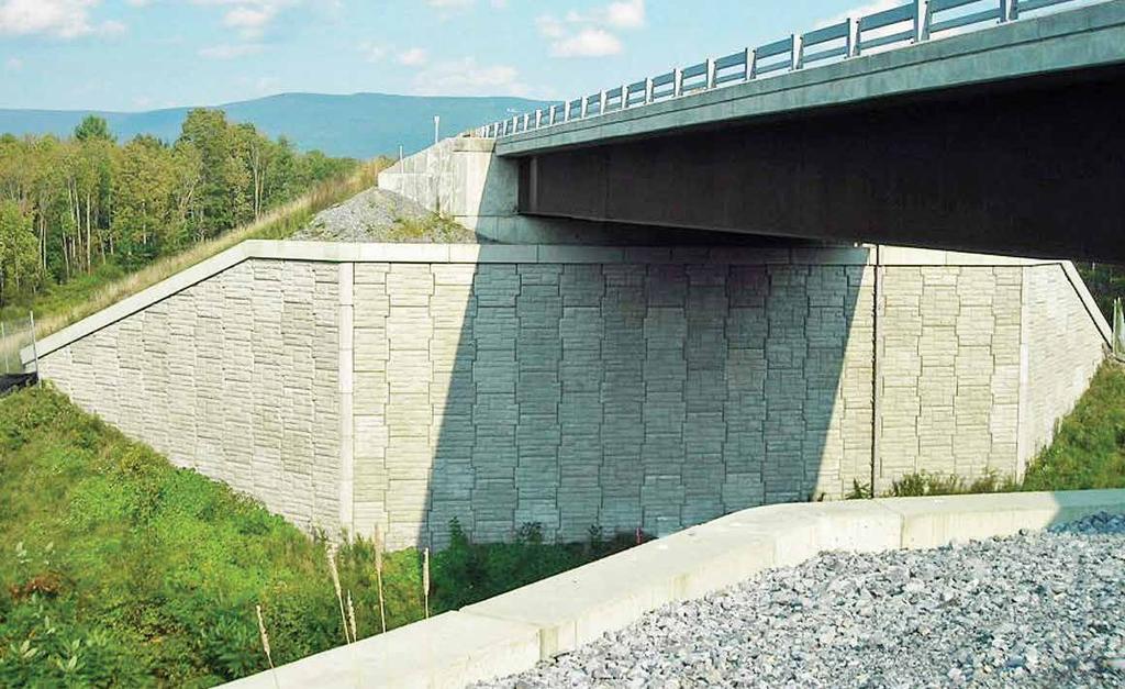 In a true Reinforced Earth abutment, the bridge beams are supported on a spread footing bearing directly on the MSE structure.