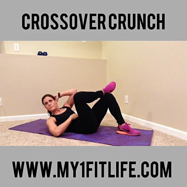 BW CROSSOVER CRUNCH HEEL DIGS Begin by lying on your back with knees bent and feet flat on the floor Cross one ankle on to the top of the other knee Place opposite hand behind your head Leading with
