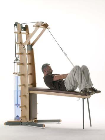 Abdominals / Lower Back / Core I 203 Cord Sit Up 1 Use the rope - Supine position on the bench - Arms stretched upwards, hands are holding the cord - Knees are bent and feet