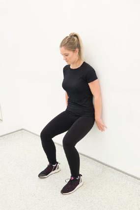 Wall squat - Stand with your back against the wall, knees apart and your feet out in front of you.