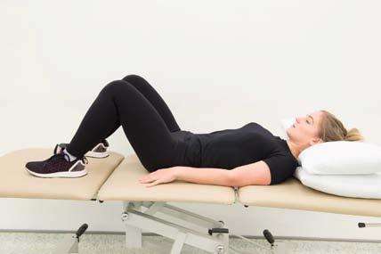 Bridge - Lie on your back with your knees bent and feet flat on the bed or floor. Squeeze your buttock muscles together then lift your hips up. Hold for five seconds before slowly lowering back down.