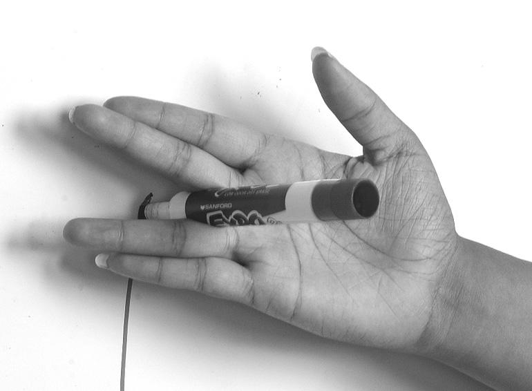 Goniometer Experiment 4. Place a pen in your hand (as shown) so that you will draw on the board while keeping the back of your hand closest to the board. 5.