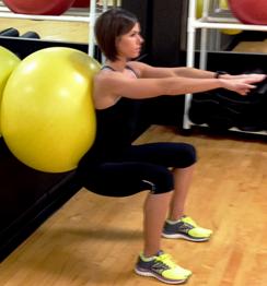 Perform a wide stance squat with body weight back in heels. 5. Pushing through heels, slowly stand back up contracting glutes at top position. Repeat at a controlled pace keeping back upright.
