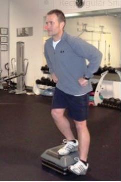 Using a controlled movement, lower the opposite leg until the heel contacts the floor.