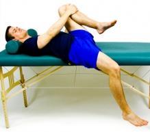 Hip Flexor Stretch While lying on a table or high bed, grasp your opposite knee and pull it towards your chest.