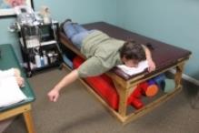 Prone Shoulder Horizontal Abduction Lie face down on the edge of a bed/mat with the target arm hanging off the side.
