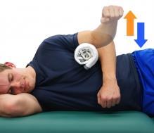 Sidelying Shoulder External Rotation with Towel Roll Lie on your side with your elbow bent to 90 degrees. Place a rolled up towel between your arm and the side your body as shown.
