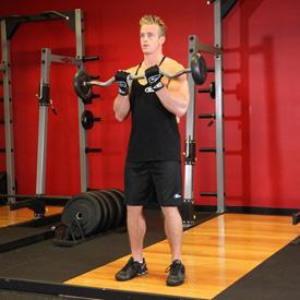 While holding the upper arms stationary, curl the weights forward while contracting the biceps as you breathe out. Tip: Only the forearms should move. 3.