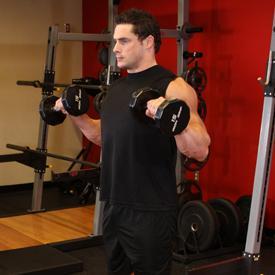 ZOTTMAN CURLS 1. Stand up with your torso upright and a dumbbell in each hand being held at arms length. The elbows should be close to the torso. 2.