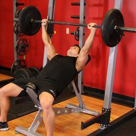 BARBELL INCLINE BENCH PRESS 1. Lie back on an incline bench.