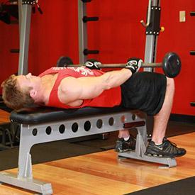 FRONT RAISE AND PULLOVER 1. Lie on a flat bench while holding a barbell using a palms down grip that is about 15 inches apart. 2.