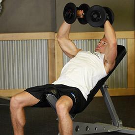 INCLINE DUMBBELL FLYS 1. Hold a dumbbell on each hand and lie on an incline bench that is set to an incline angle of no more than 30 degrees. 2.