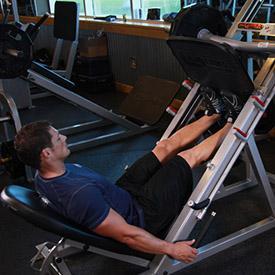 CALF RAISES ON LEG PRESS 1. Using a leg press machine, sit down on the machine and place your legs on the platform directly in front of you at a medium (shoulder width) foot stance. 2.