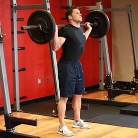 SQUATS 1. This exercise is best performed inside a squat rack for safety purposes. To begin, first set the bar on a rack to just below shoulder level.