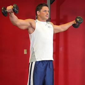 BENT ARM SIDE LATERAL RAISES 1. Stand up with your torso upright and a dumbbell on each hand being held at arms length. The elbows should be close to the torso. 2.