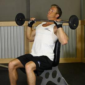 ROCKY PRESSES 1. Sit on a Military Press Bench with a bar at shoulder level with a pronated grip (palms facing forward).