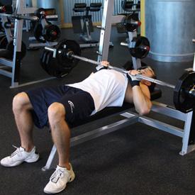 CLOSE GRIP BARBELL BENCH PRESS 1. Lie back on a flat bench. Using a close grip (around shoulder width), lift the bar from the rack and hold it straight over you with your arms locked.