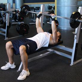 Tip: Make sure that - as opposed to a regular bench press - you keep the elbows close to the torso at all times in order to maximize triceps involvement. 3.