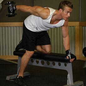 TRICEPS DUMBBELL KICKBACKS 1. Start with a dumbbell in each hand and your palms facing your torso. Keep your back straight with a slight bend in the knees and bend forward at the waist.