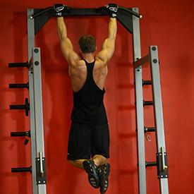 WIDE GRIP PULL-UPS 1. Grab the pull-up bar with the palms facing forward using the prescribed grip.