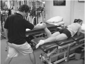 Manual prne eccentric / cncentric hamstring curls. Athlete lays prne while manual resistance is applied distally.