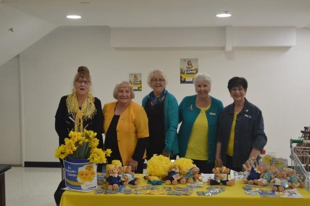 Lyn and Elizabeth from Alpha Pi with armloads of daffodils and bears The release goes on to explain Cancer Council is encouraging Australians to text to donate and dedicate a daffodil to support