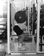 DB Squat/Jump Combo Start with feet parallel and shoulder width apart holding a dumbbell in each hand on the side of the body, set the back by sticking the chest and the
