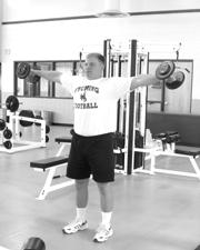 Front Raise Start standing with feet shoulder width apart with knees slightly bent, holding a dumbbell in each hand in front of the body.