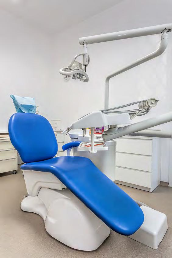 The dentist shows me one of his fancy chairs.