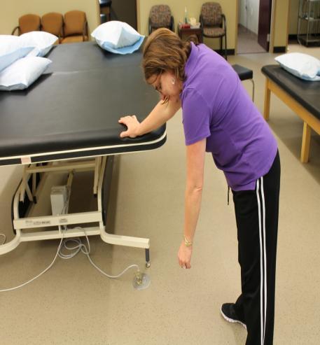 Shoulder Home Exercise Program Champion Orthopedics Range of Motion Pendulum: Holding the side of a table with your good arm, bend