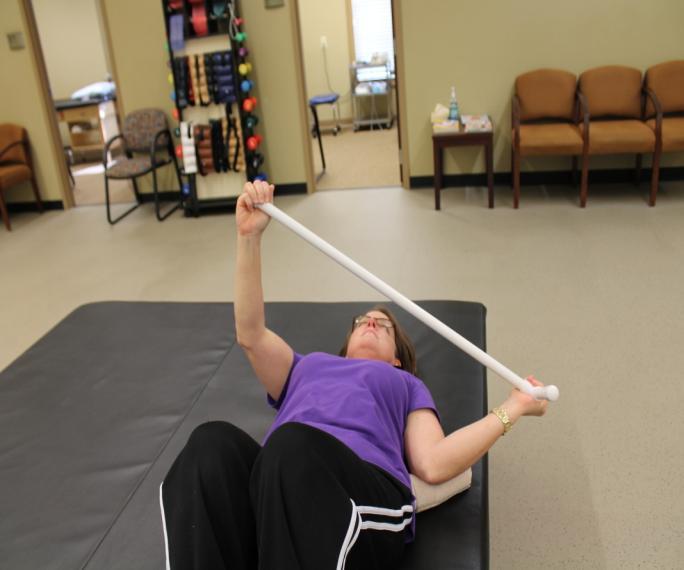 Passive External Rotation: While lying down, hold a cane/broom/golf club in both hands with elbow bent at 90degrees.
