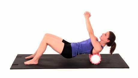 Rhomboids Mobilization on Foam Roll Begin sitting on the floor with a wrapped foam roll horizontally under your upper back.
