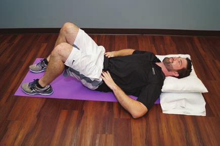 Ab brace 1. Lie on your back with your spine in a neutral position and place your fingers on your belly just inside your hip bones so you can feel the contraction. 2.