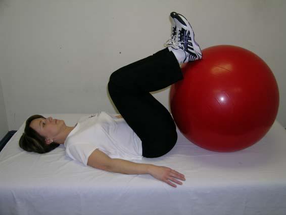 LOW BACK On back, feet resting on ball, pull knees to chest until stretch