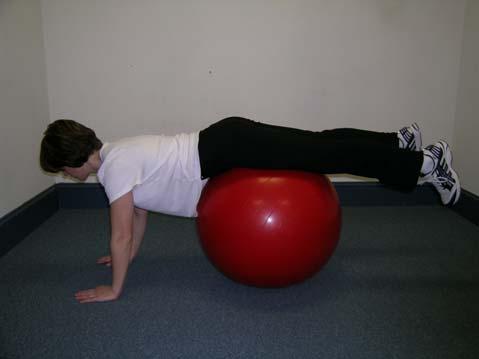 BALL PLANKS (intermediate) Position self on ball, walking out with arms until tops of feet are resting on ball.