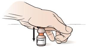 Fig ure 2. Pressing the cap. Turn the vial upside down several times until the medication is fully mixed.