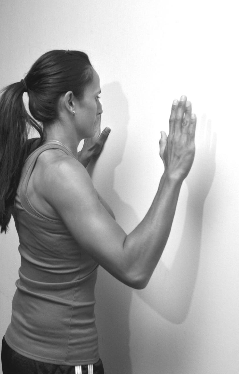 Page 4 of 7 Shoulder blades I at wall Start with both hands on wall, elbows